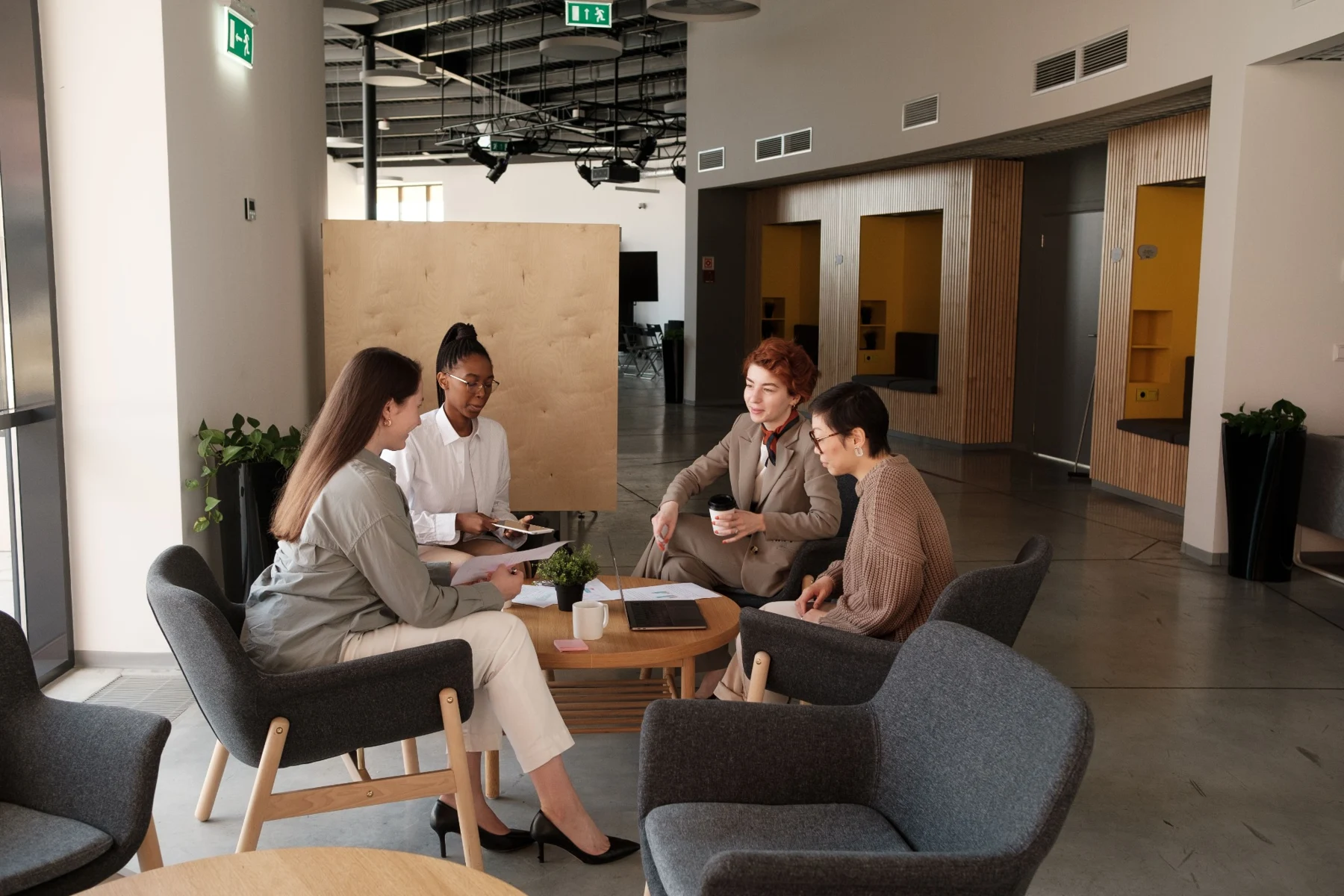 Colleagues sharing ideas during an informal office meeting